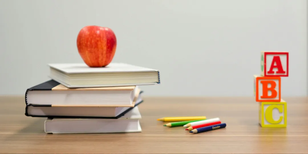 books and learning utensils on table