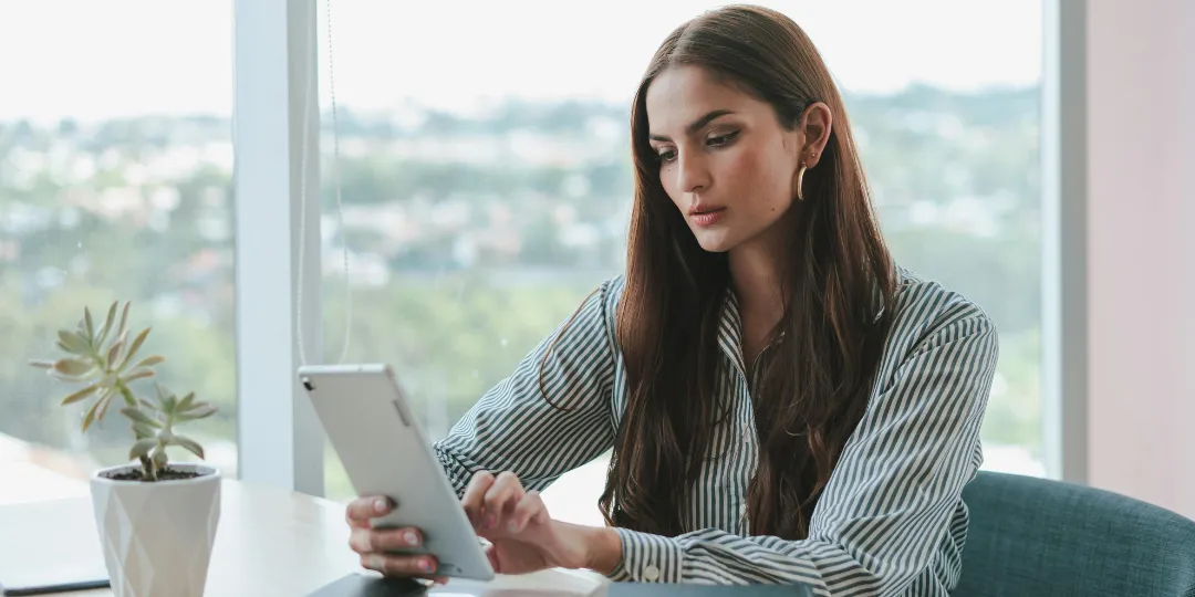 business woman looking at ipad