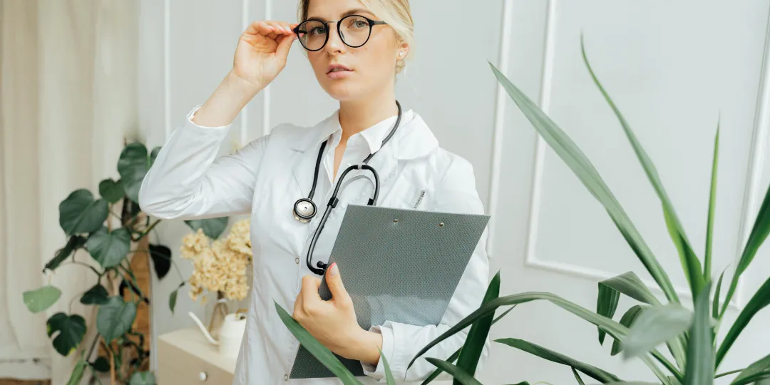 doctor adjusting glasses