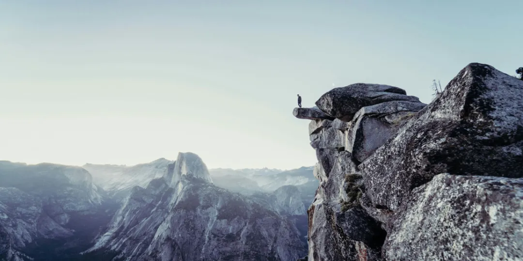 person standing on a cliff