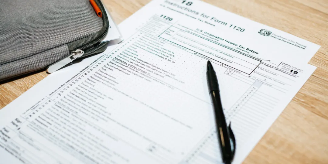 tax form on table with pen