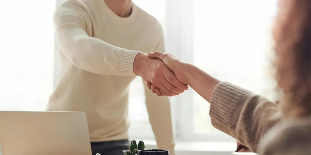 two people shaking hands