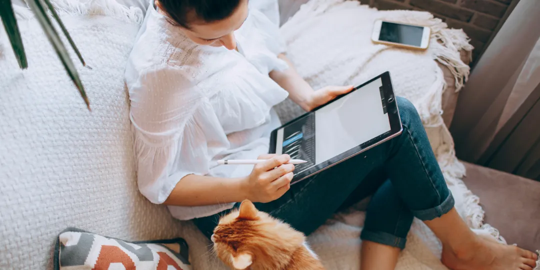 woman on a sofa with a cat